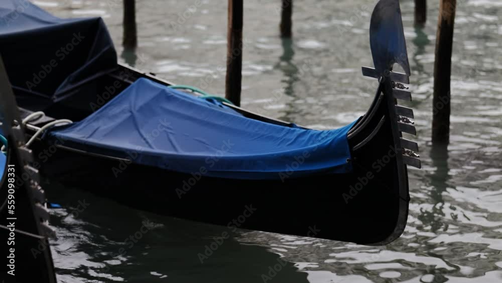 Venice, Italy - gondolas and gondoliers in the Grand Canal near the Rialto Bridge, in the San Marco Basin and between the canals of the lagoon city Venice, Italy - gondolas and gondoliers in the Grand Canal near the Rialto Bridge, in the San Marco Basin and between the canals of the lagoon city
