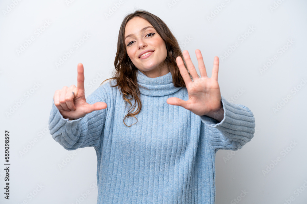 Young caucasian woman isolated on white background counting seven with fingers Young caucasian woman isolated on white background counting seven with fingers