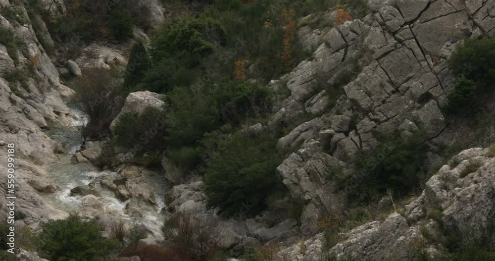 mountain creek flows through the stone canyon. top view on river. autumn landscape in montenegro mountain creek flows through the stone canyon. top view on river. autumn landscape in montenegro