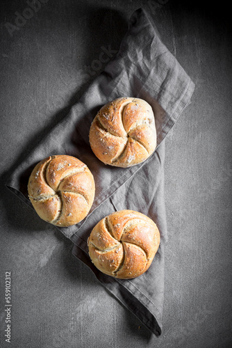 Top view of buns on linen napkin and concrete photo