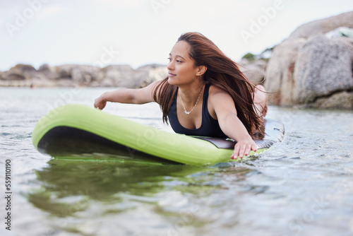 Photography Fitness, surfer woman surfing in ocean with surfboard, swimwear and peace with sport outdoor and nature