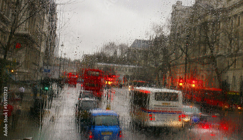 The glow of traffic lights in the rain in London, England