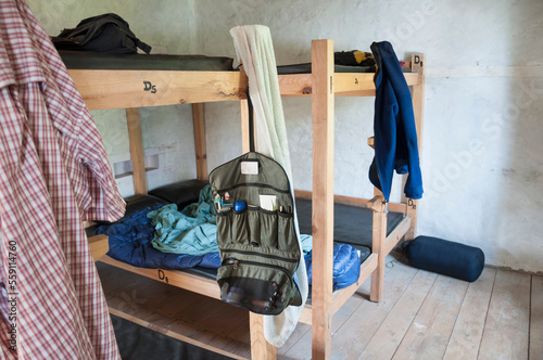 Wooden bunk beds cabin clothes hanging