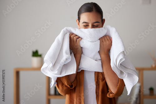 Billede på lærred Laundry, fresh and woman smelling a towel after cleaning, housework and washing clothes in the morning