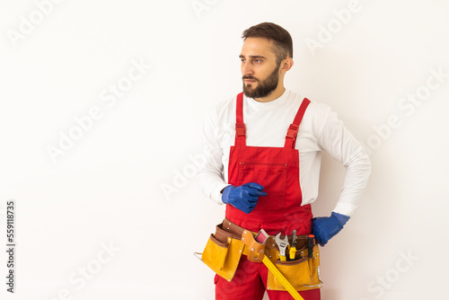 profession, construction and building - happy smiling male worker or builder over white background