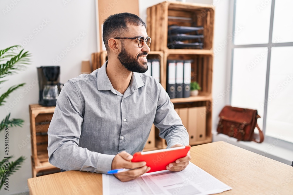 Young hispanic man business worker smiling confident using touchpad at office Young hispanic man business worker smiling confident using touchpad at office