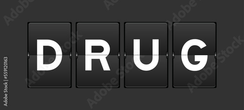 Black color analog flip board with word drug on gray background