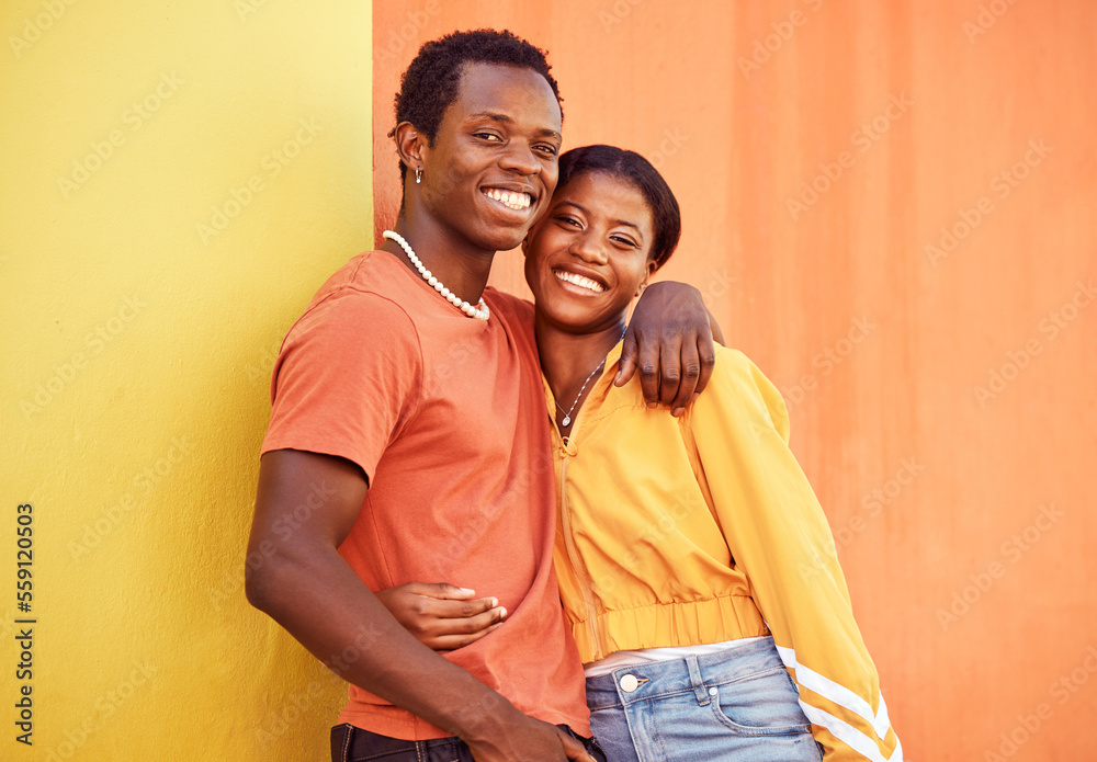 Naklejka premium Black couple, youth and fashion with gen z, hug and together with color and portrait against wall background. Black man, black woman and young with trendy streetwear, mockup and marketing in Nigeria.