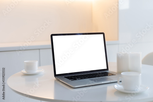 Laptop blank screen on wood table cafe background, mockup, template for your text, Clipping paths included for background and device screen