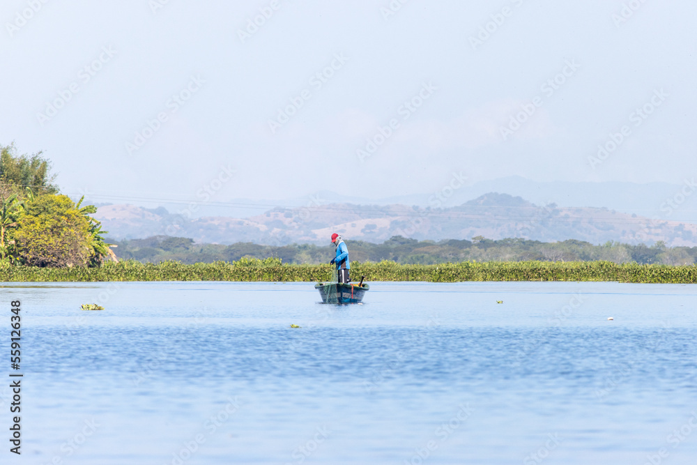 Fisherman in the Olomega lagoon in San Miguel, El Salvador