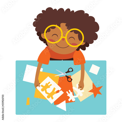 Top View Of Kid Cutting Paper