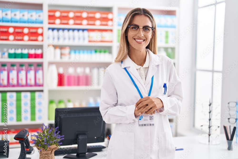 Young blonde woman pharmacist smiling confident standing at pharmacy Young blonde woman pharmacist smiling confident standing at pharmacy