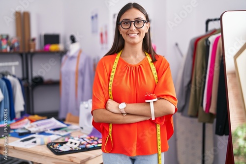 Photos Young beautiful hispanic woman tailor smiling confident standing with arms cross