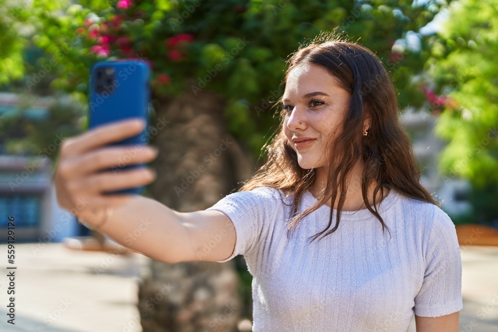 Young woman smiling confident making selfie by the smartphone at street Young woman smiling confident making selfie by the smartphone at street