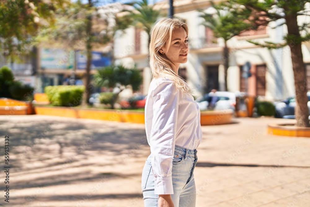 Young blonde woman smiling confident standing at park Young blonde woman smiling confident standing at park