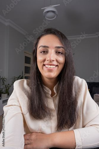 Video conference call, happy business woman talking video conference call on phone. Freelance distant client conversation. Smiling, beautiful, confident female. Smartphone camera, webcam online job. photo