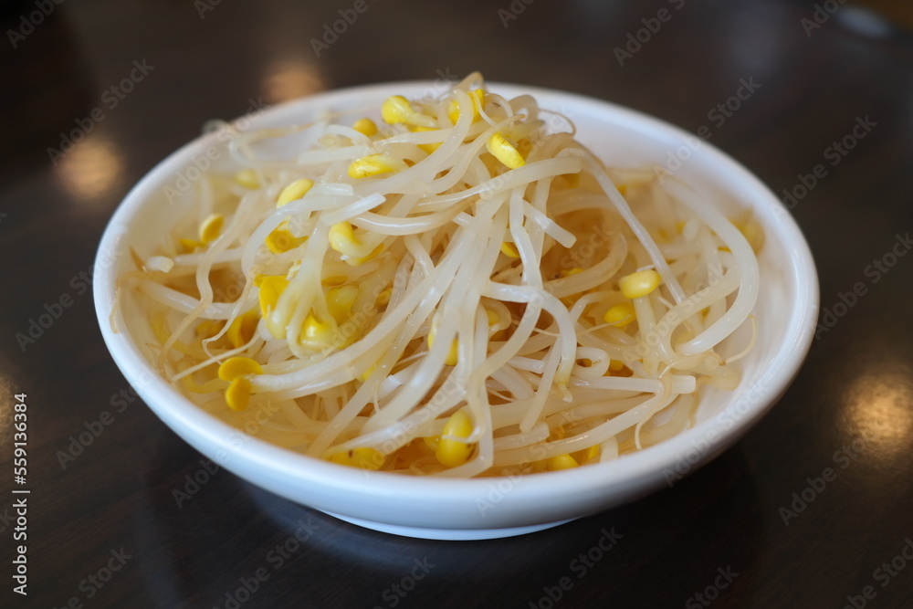 Seasoned bean sprouts served on a white plate Seasoned bean sprouts served on a white plate