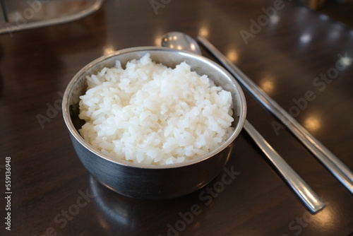 Rice and spoon chopsticks are served on the table
