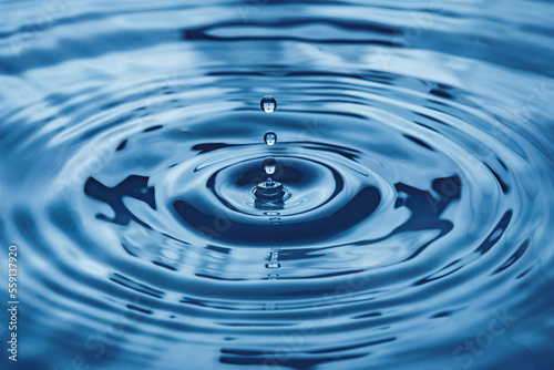 water droplets splash blue closeup