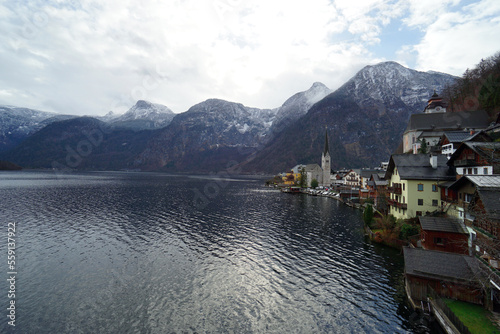Stunning view of the Hallstatt village surrounded by mountains and beautiful nature in winter. © saichol