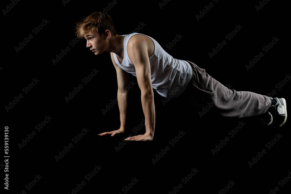 Fototapeta premium A 17 Year old wearing a white tank top