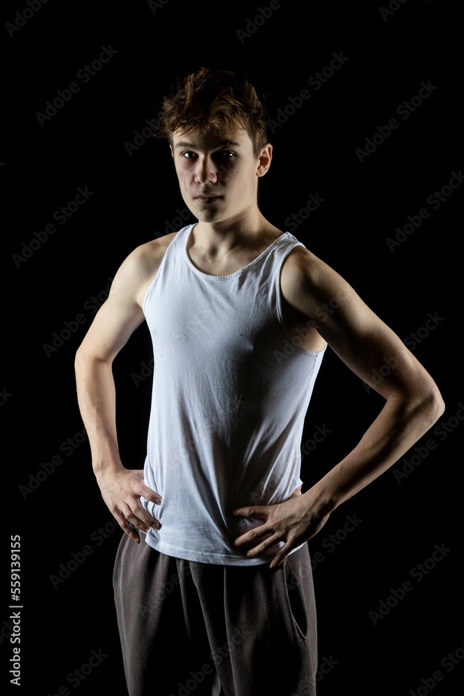 Naklejka premium A 17 Year old wearing a white tank top