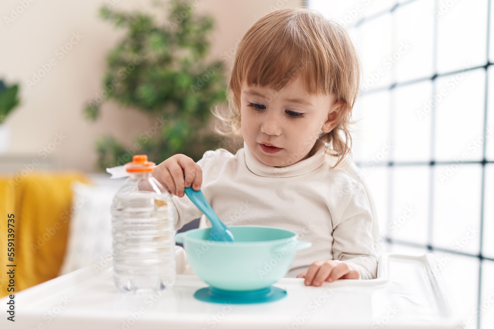 Adorable hispanic girl eating at home Adorable hispanic girl eating at home