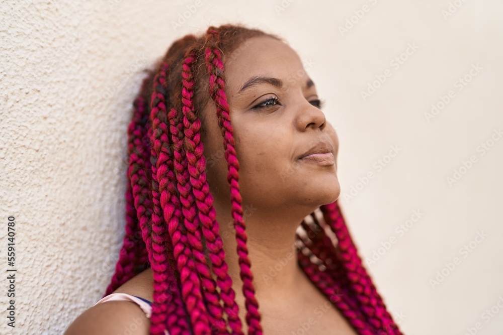 African american woman with relaxed expression standing at street African american woman with relaxed expression standing at street
