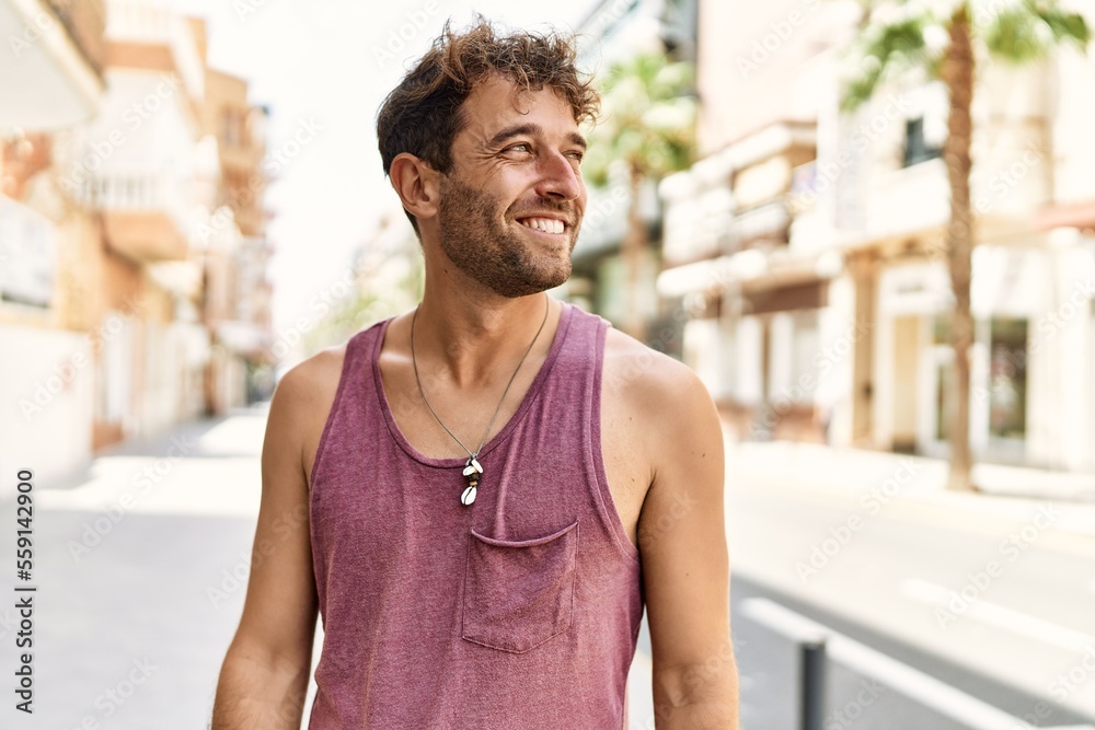Young hispanic man smiling confident walking at street Young hispanic man smiling confident walking at street