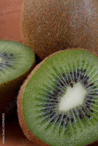 Closeup of whole and sliced kiwifruit