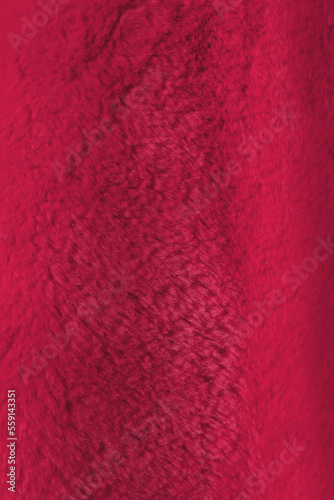 Red delicate soft vertical background of plush fabric. Viva Magenta color decor 