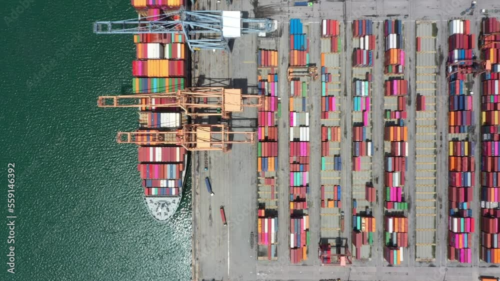 Aerial view of sea freight, Cargo ship, Cargo container in factory harbor at industrial estate for import export around in the world, Trade Port / Shipping - cargo to harbor. 4K Footage. Aerial view of sea freight, Cargo ship, Cargo container in factory harbor at industrial estate for import export around in the world, Trade Port / Shipping - cargo to harbor. 4K Footage.