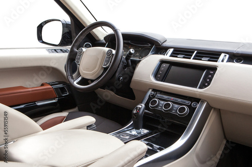 Car interior luxury. red leather comfortable seats, steering wheel, dashboard, climate control, speedometer, display, leather © AvokadoStudio