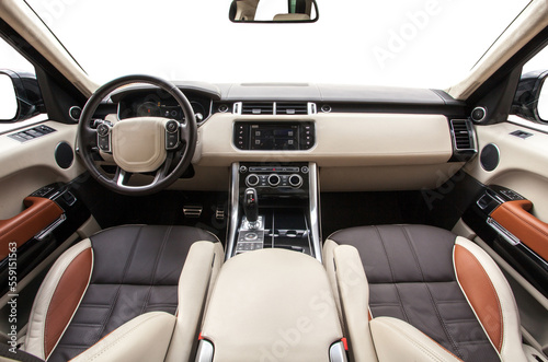 interior of a modern premium SUV with a leather interior and a white background © AvokadoStudio