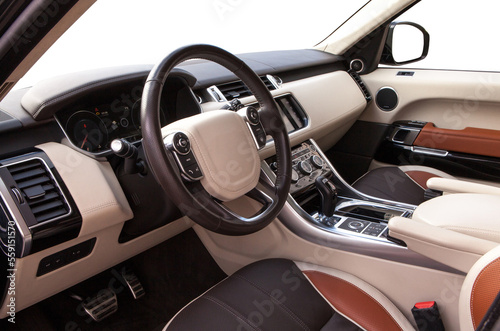 interior of a modern premium SUV with a leather interior and a white background © AvokadoStudio