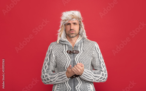 cold handsome man wear sweater and winter hat, face