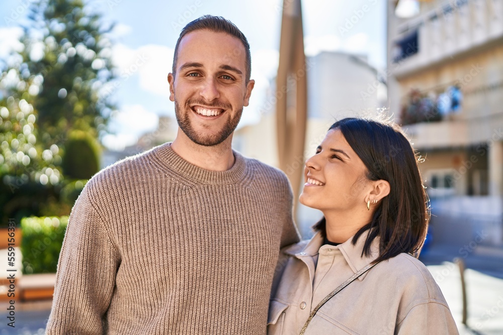 Man and woman couple smiling confident hugging each other standing at park Man and woman couple smiling confident hugging each other standing at park