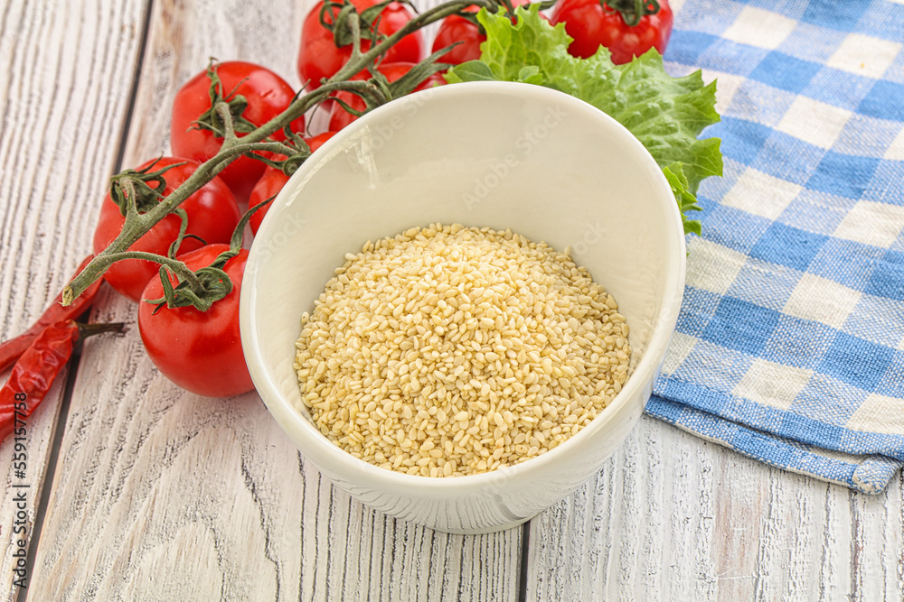 Raw sesame seeds in the bowl Raw sesame seeds in the bowl