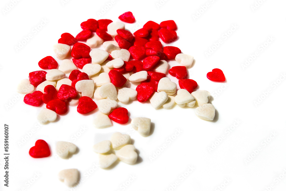 Many small white and red hearts on a white isolated background. The concept of love and romance. Romantic background composition. Valentine's Day Many small white and red hearts on a white isolated background. The concept of love and romance. Romantic background composition. Valentine's Day