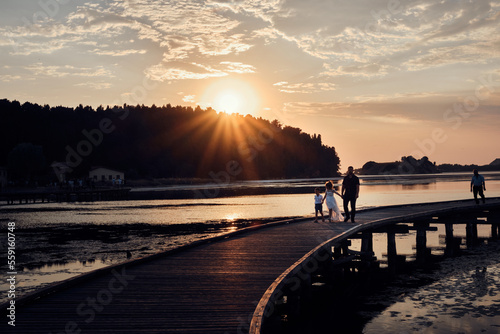 Fototapeta Naklejka Na Ścianę i Meble -  Silhouette on a bridge at sunset