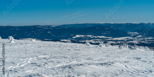 Jeseniky mountains with Keprnik and Praded hills from Kralicky Sneznik hill summit during winter photo