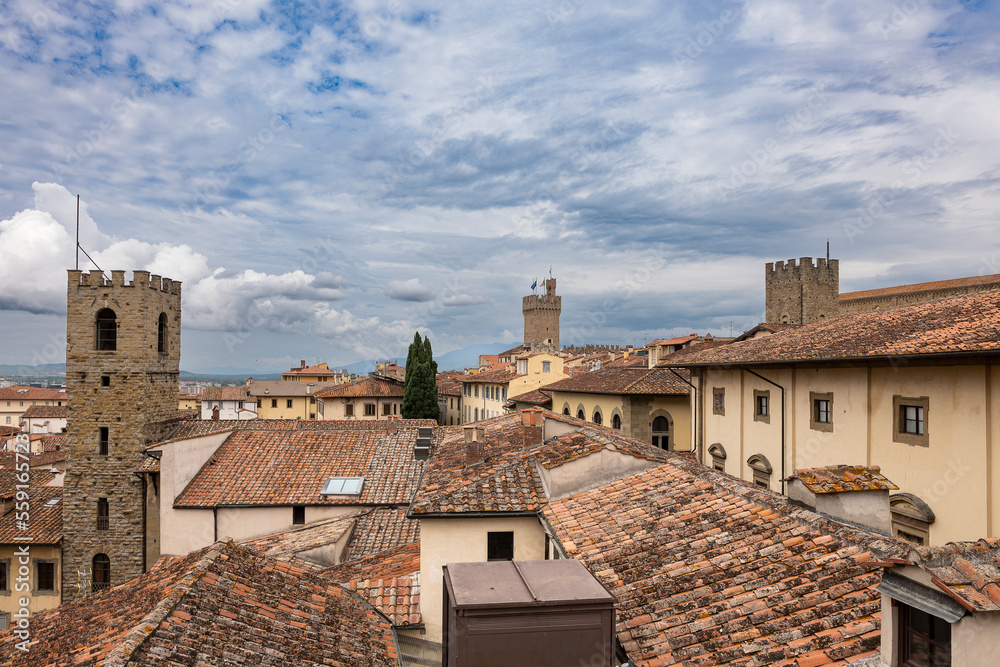 A cloudy day in Arezzo: a view of the city's bell towers, towers, and roofs from the Confraternita dei Laici tower A cloudy day in Arezzo: a view of the city's bell towers, towers, and roofs from the Confraternita dei Laici tower
