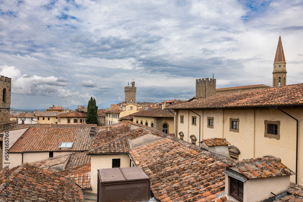 A cloudy day in Arezzo: a view of the city's bell towers, towers, and roofs from the Confraternita dei Laici tower