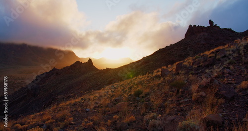 Mountain silhouette at sunset. Golden hour, clouds above Teide National Park in Tenerife, Canary Island, Spain.