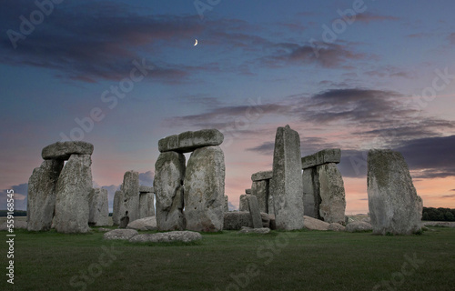 Sunset at Stonehenge. Dolmen in Dorset Great Brittain. UK. Megalitic stoes. Moon.