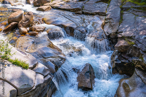 A waterfall  on the river Ammonoosuc River flow around round granite blocks flows down from Mount Washington  New Hampshire  USA