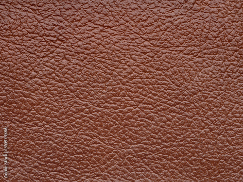 Genuine soft brown leather skin natural with design lines pattern or red abstract background. Genuine leather texture. Use wallpaper or backdrop luxury event, design upholstered furniture, clothing.