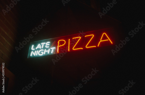 Neon sign that says "Late Night Pizza"