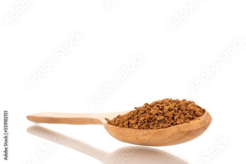 Fragrant instant coffee with wooden spoon, macro, isolated on white background.