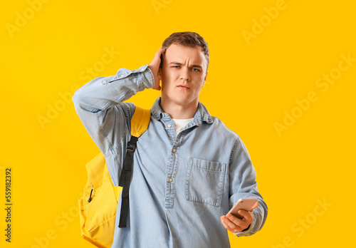 Upset young man with backpa...